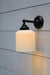 Portofino Ribbed Ceramic Wall Light in black swivel arm
