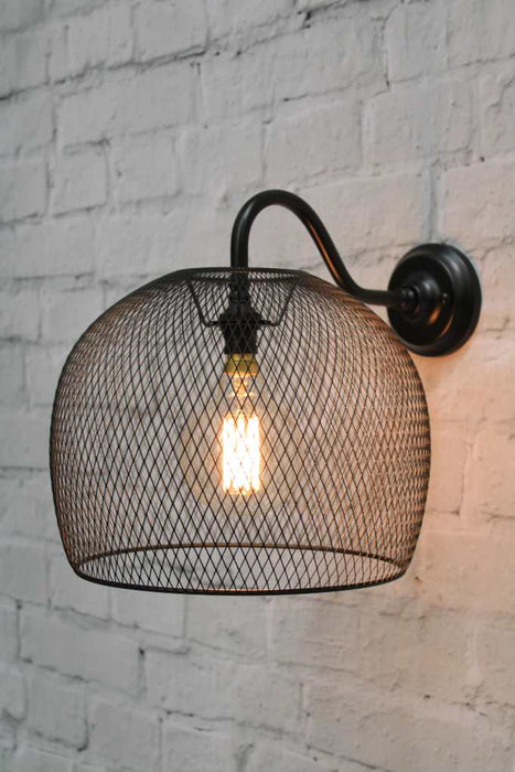Black wall light with metal basket shade