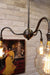 Industrial gooseneck chandelier with bare bulbs