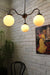 Industrial gooseneck glass chandelier with opal glass shades