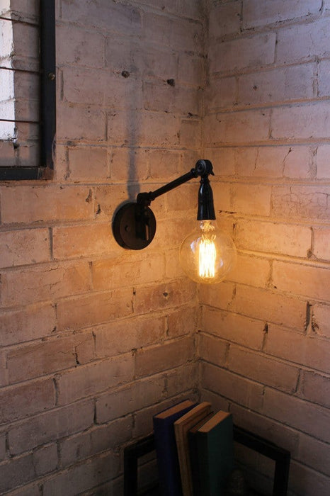 Industrial swing arm wall light with xlarge edison bulb