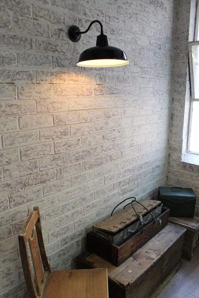 Industrial warehouse gooseneck wall light in vintage setting