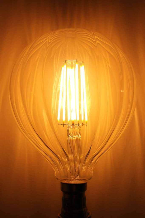 LED Filament Waterfall Light Bulb. The glass of these LED filament bulbs has been crafted with a decorative waterfall pattern