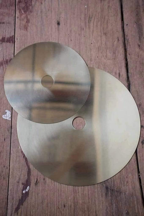 Large and small brass discs