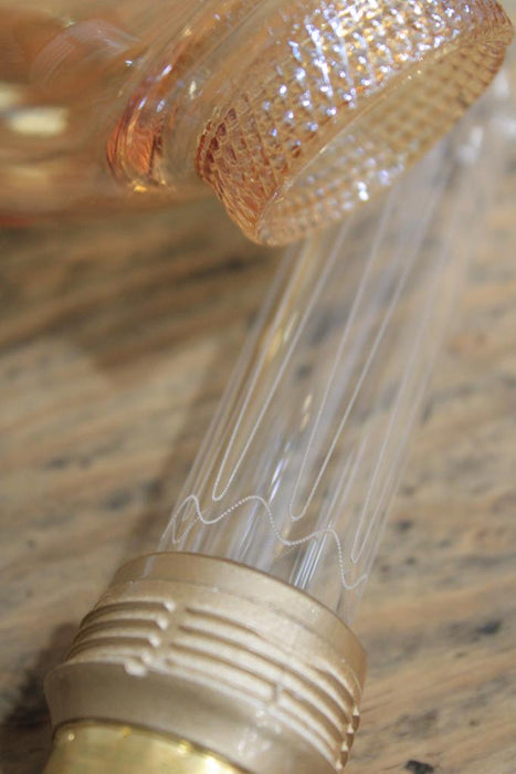 Round amber bulb with laser-cut filament with glass unscrewed