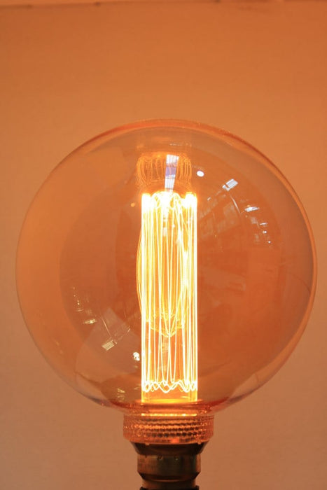 Round amber bulb with laser-cut filament