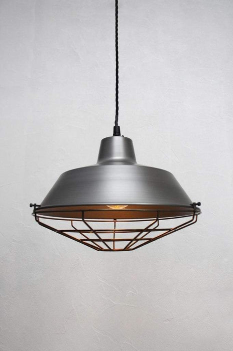 Metal cage guard on raw steel pendant shade