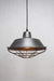 Metal cage guard on raw steel pendant shade
