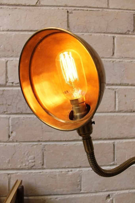 Metal flexible arm table lamp with a small tubular edison bulb