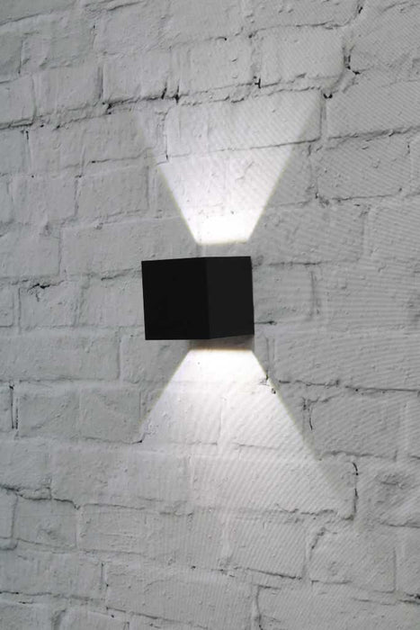 Monmouth LED Exterior Light fixed on a wall in black