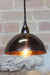 Mottled brown Bakelite Bowl Pendant Light with black pendant cord. 