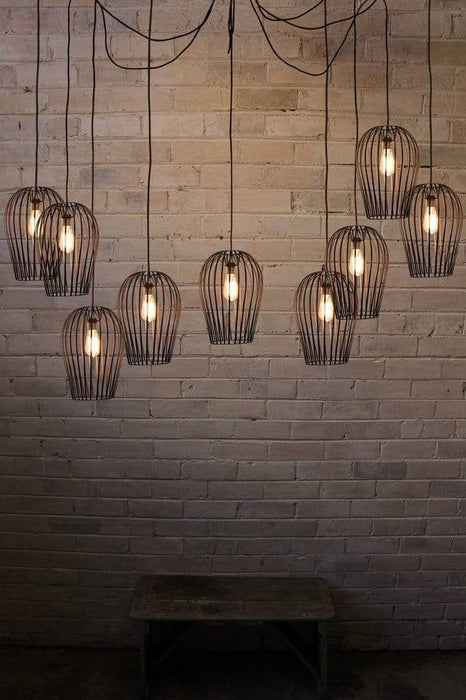 Multi light pendant with cages. cage lighting for high ceilings