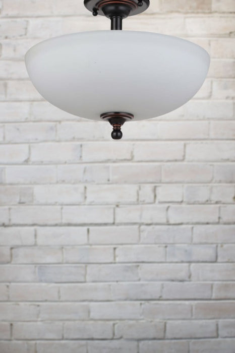 Opal glass flush mount with bronze metalware
