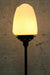 Black table lamp with opal glass shade