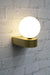 Opal glass wall light with gold sconce