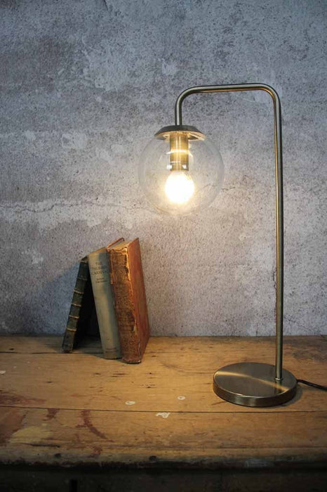 Orb glass table lamp with brass metalware and spherical glass