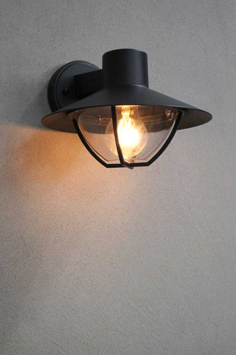 Outdoor wall light with caged shade