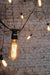 Outdoor festoon string lights with edison light bulb squirrel cage filament. old school bulbs
