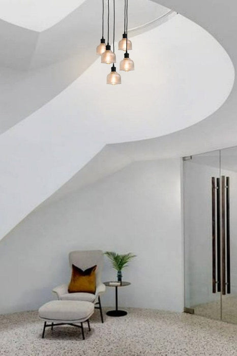Five light small pendant in stairwell