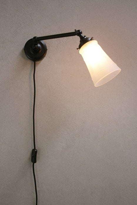 Long arm wall light with tiltable shade