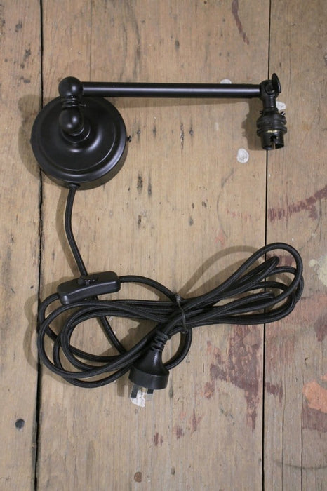 Long steel black sconce with wall plug and inline switch