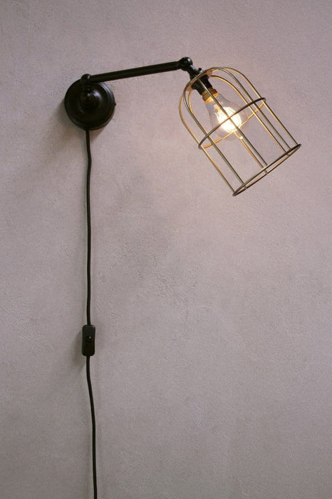 Plug-in wall light with gold cage