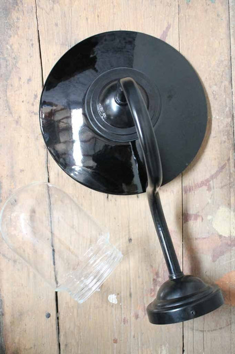Porcelain enamel glossy black outer with contrasting white inner. comes with glass shade and gooseneck wall sconce