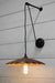 Pulley wall light with large rust shade