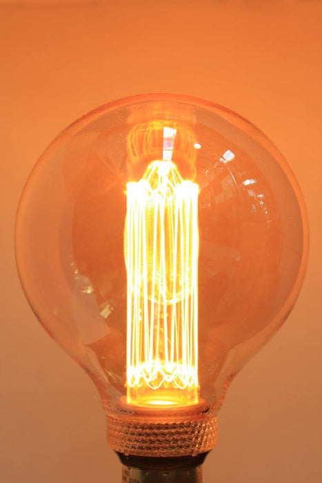 Round amber bulb with laser-cut LED filament