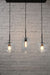 Three light linear pendant with mixed shades B and black ceiling rose