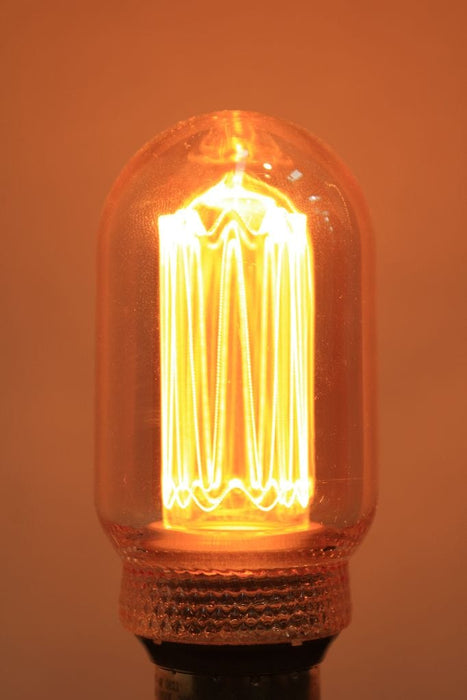 Laser-cut filament amber LED bulb