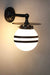 Small black brass wall light with opal two stripe shade