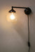 Plug in wall light with clear shade
