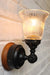Small glass wall light with black batten holder
