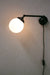 Plug-in sconce with small opal shade