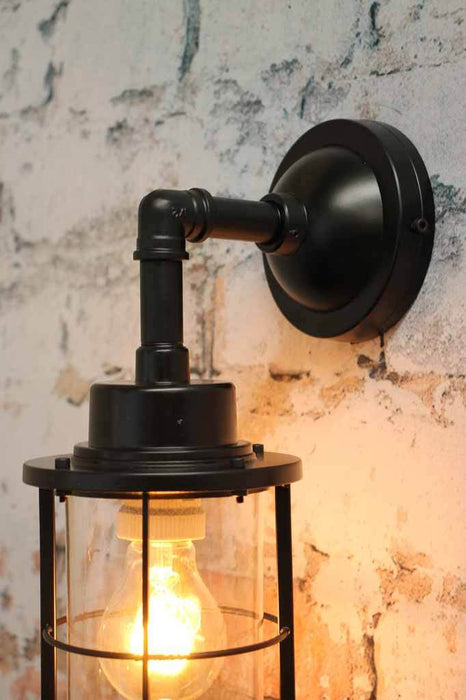 Steel construction of wall sconce and black metalware wall