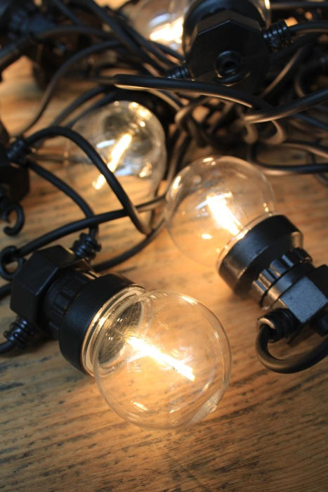 Outdoor string light with filament LED bulbs