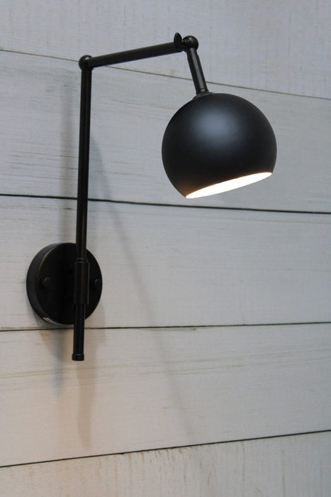 Black swivel wall light with round black shade