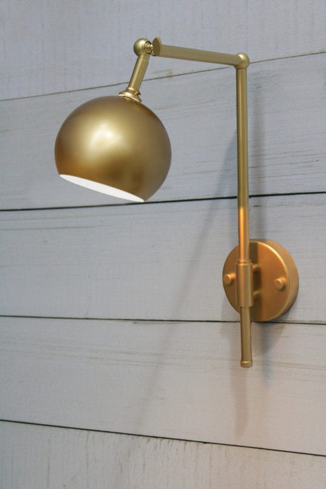 Gold/brass swivel wall light with round gold/brass shade