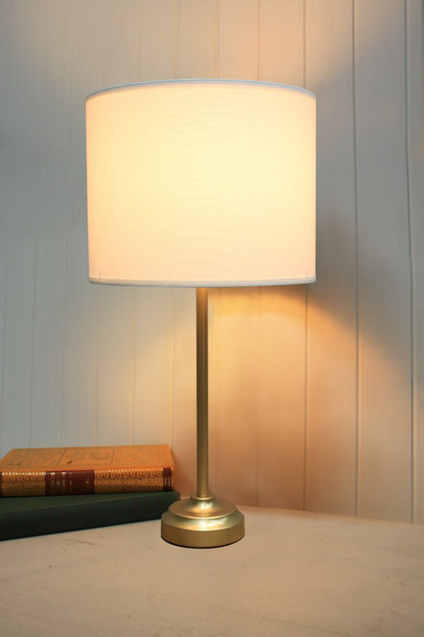 Gold table lamp with white fabric shade
