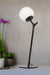 Black table lamp with opal shade
