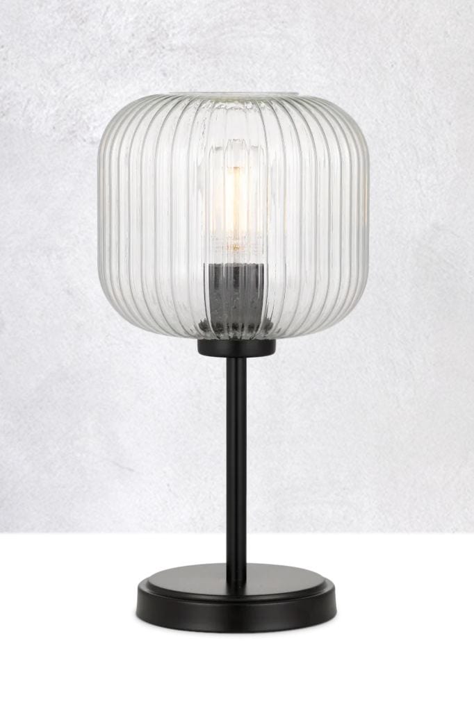 Clear glass table lamp with black base