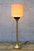 Ribbed ceramic shade with a gold candlestick lamp base