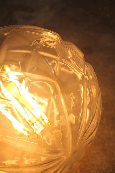 These cut crystal style dimmable LED filament light bulbs take inspiration from the delicate craftsmanship of crystal cutting widely seen in vintage crystal decanters