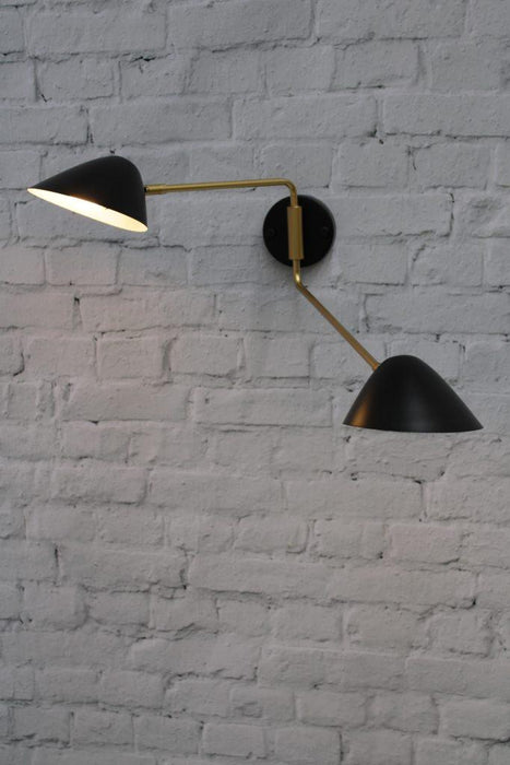 Black and brass wall light with two adjustable shades