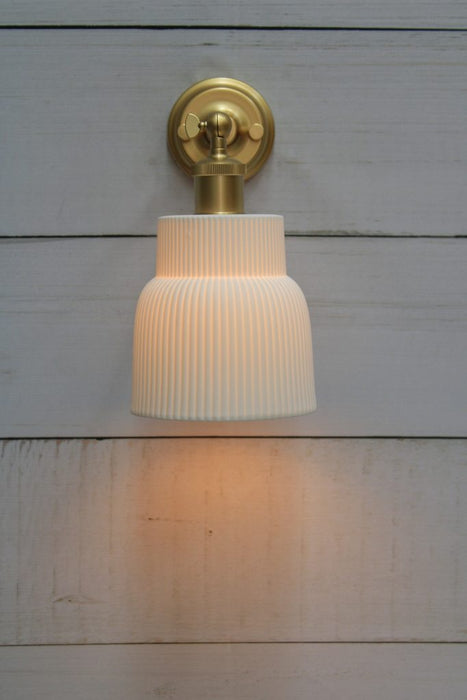 Gold/brass wall light with ceramic shade