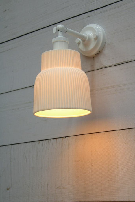 White wall light with ceramic shade