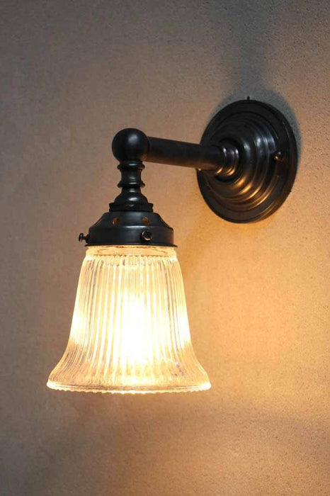 Vintage and industrial wall light. holophane glass shade.  