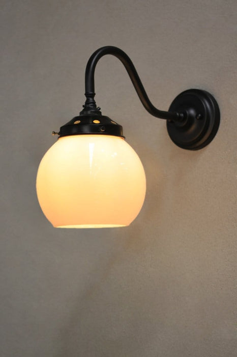black gooseneck wall light with small opal shade