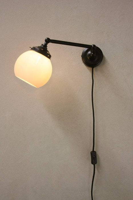 adjustable black wall light with small opal shade